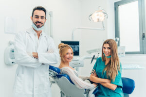 dental team posing in a modern dental office